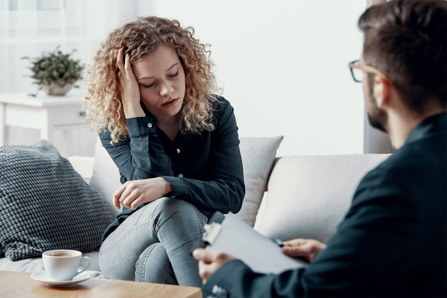 woman discussing relapse with therapist